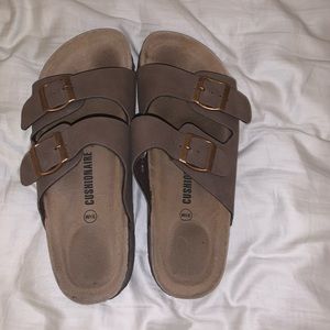 Birkenstock looking sandals.